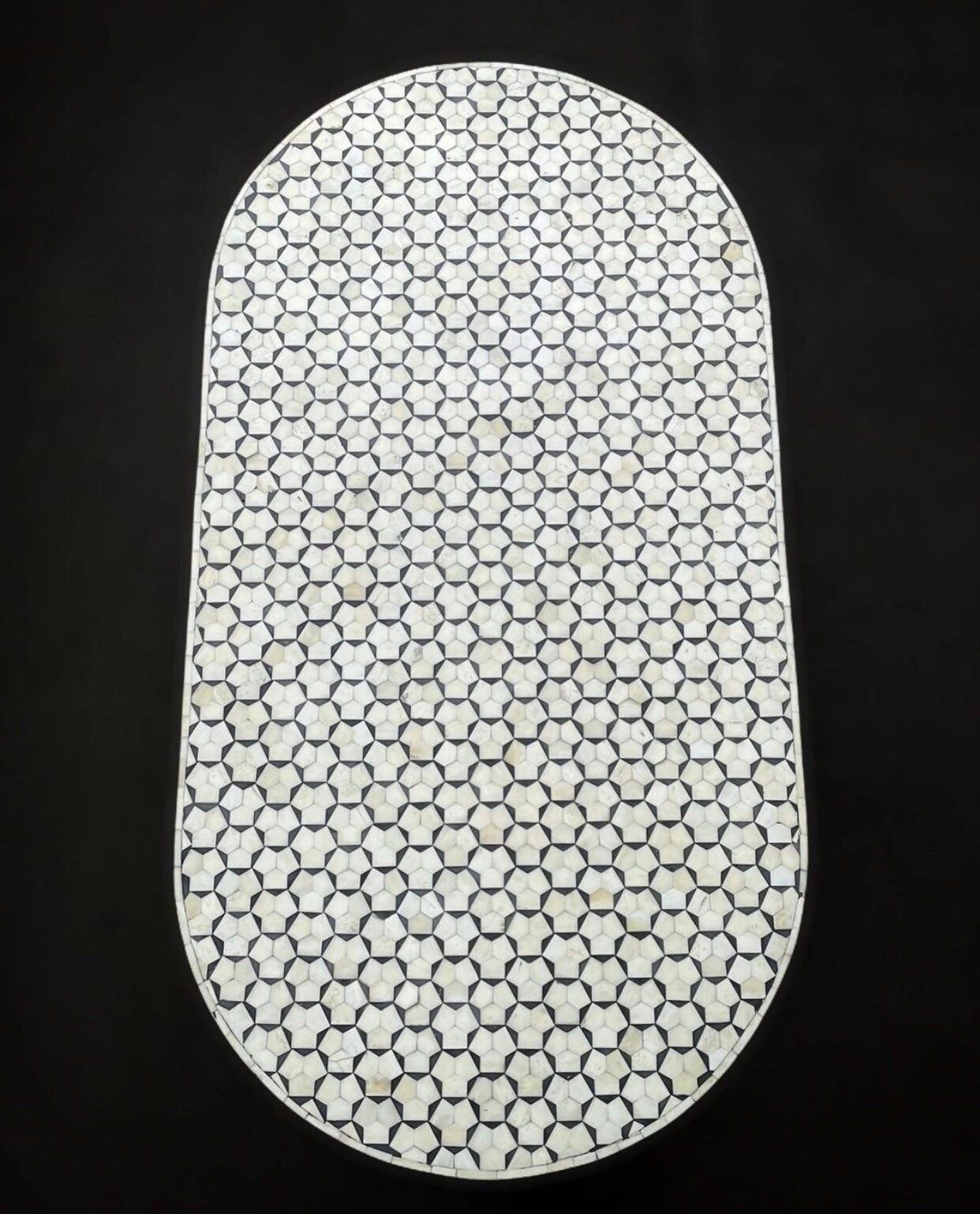   Heritage inlay targua pattern with brass metal base on wooden oval coffee table 