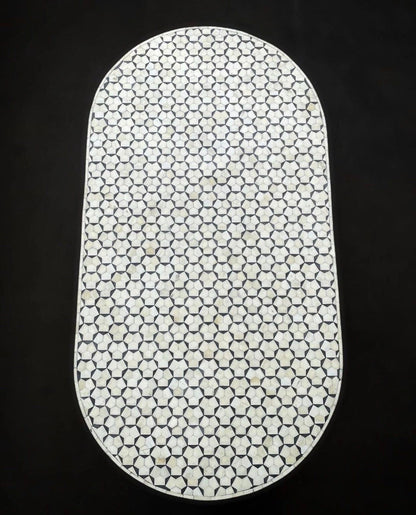   Heritage inlay targua pattern with brass metal base on wooden oval coffee table 