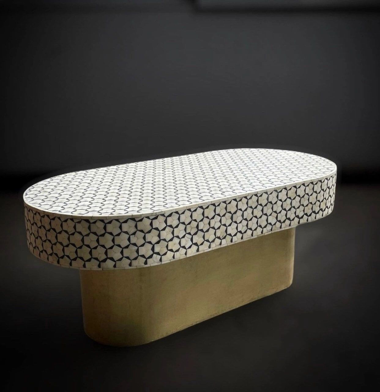   Heritage inlay targua pattern with brass metal base on wooden oval coffee table 
