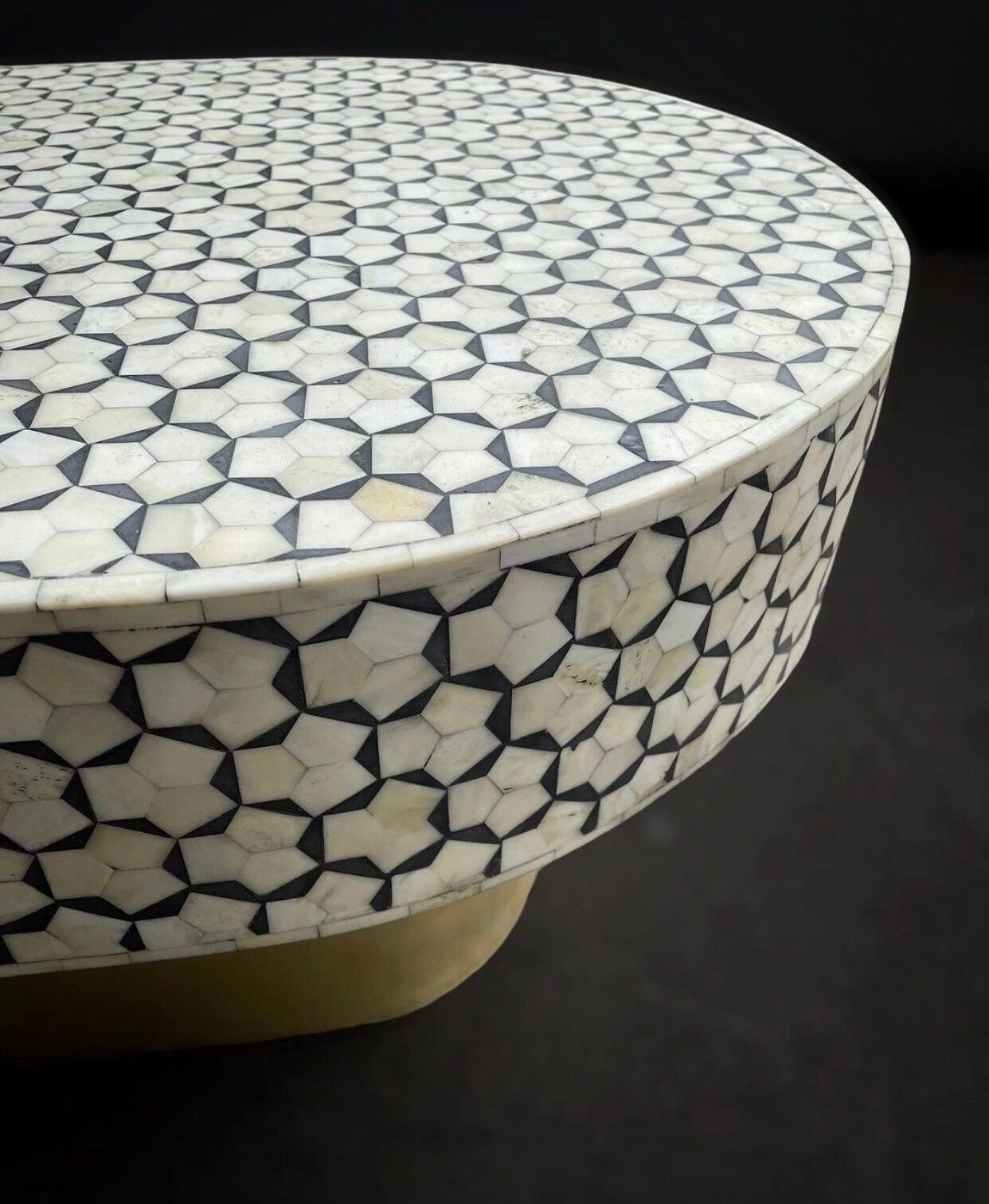   Heritage inlay targua pattern with brass metal base on wooden oval coffee table 